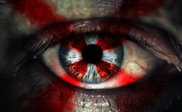 Un particolare del poster del film horror Resident Evil: Welcome to Raccoon City.